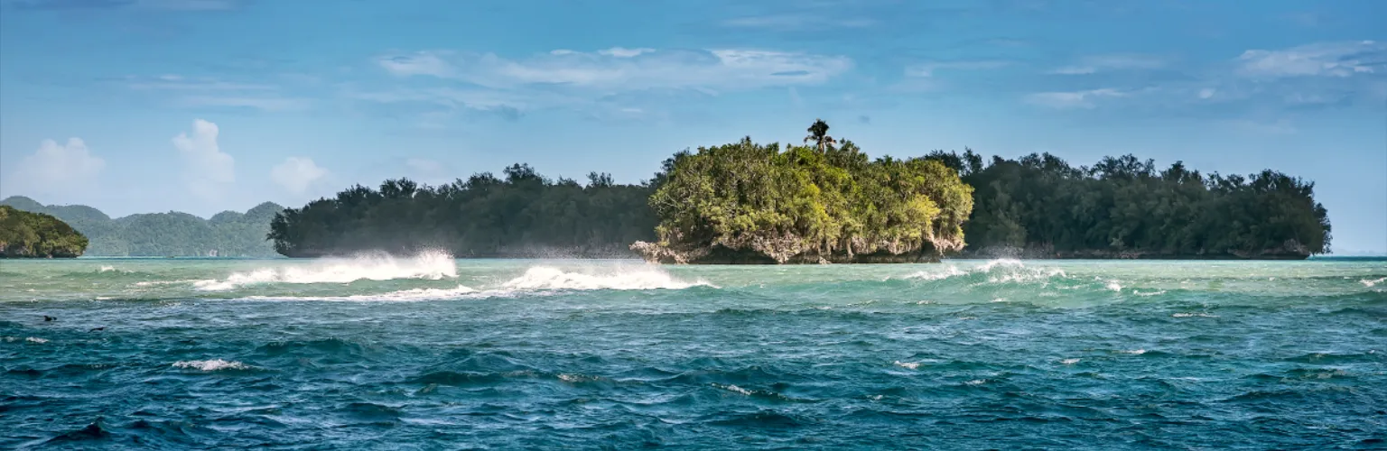 Rock Islands in Palau with wild, wavy waters in front
